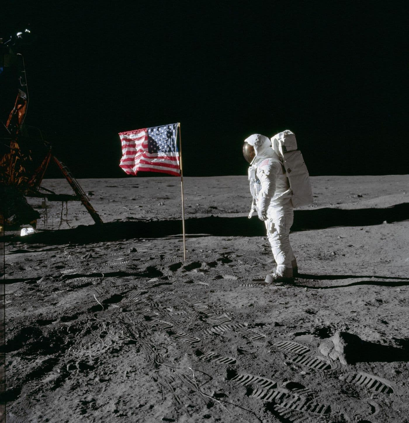 Buzz Aldrin stands by the US flag on the lunar surface, Apollo 11 (NASA AS11-40-5875).