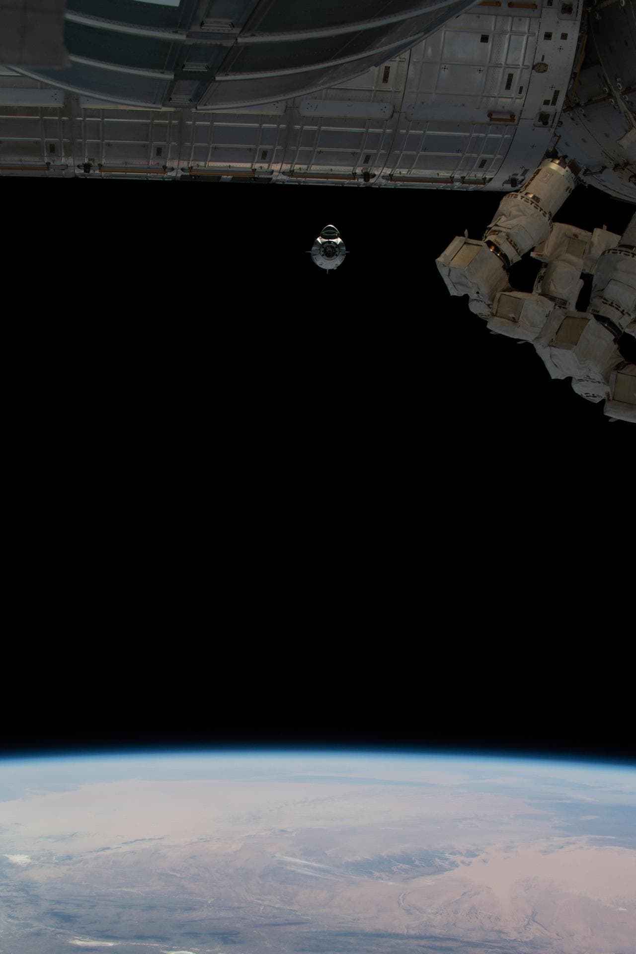 Crew Dragon approaches the International Space Station during Demo-1