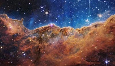 The "Cosmic Cliffs", the edge of the star-forming region NGC 3324 in the Carina Nebula, in a NIRCam image from Webb's first set of full-colour images (July 2022).