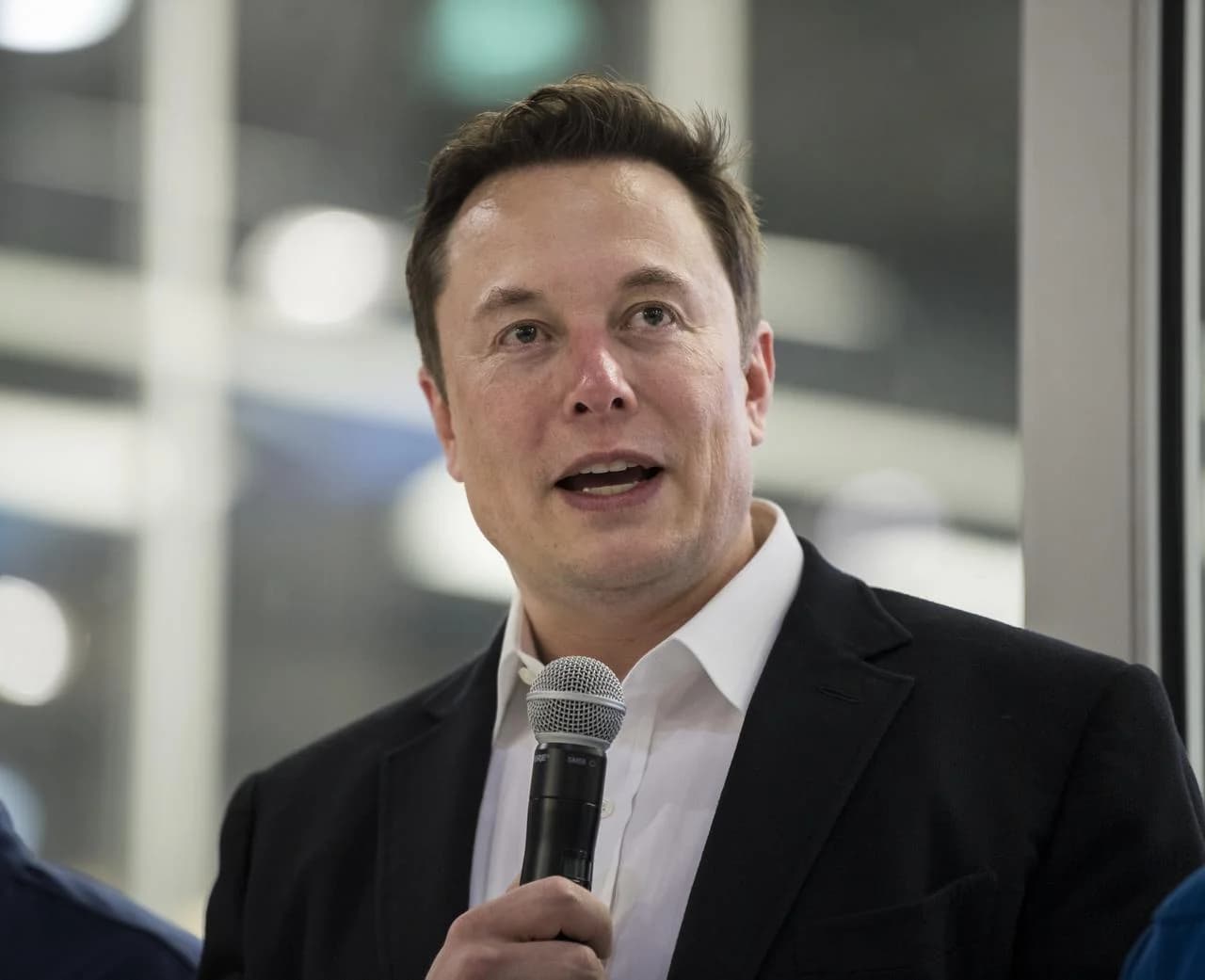Elon Musk answering questions in front of a Crew Dragon spacecraft at SpaceX headquarters on 10 October 2019. Photograph: NASA / Aubrey Gemignani.