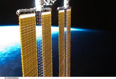 The ISS P4 and P6 solar arrays above Earth's horizon, photographed during STS-124 on 10 June 2008. Maintaining a station's orbit requires tracking and occasional corrections. NASA.
