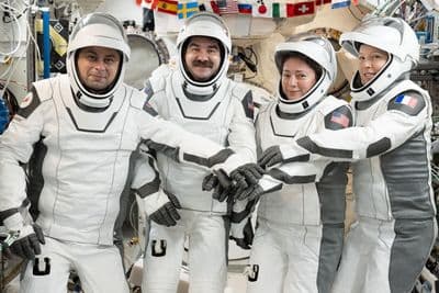 NASA's SpaceX Crew-12 members gather for a portrait in their Dragon pressure suits