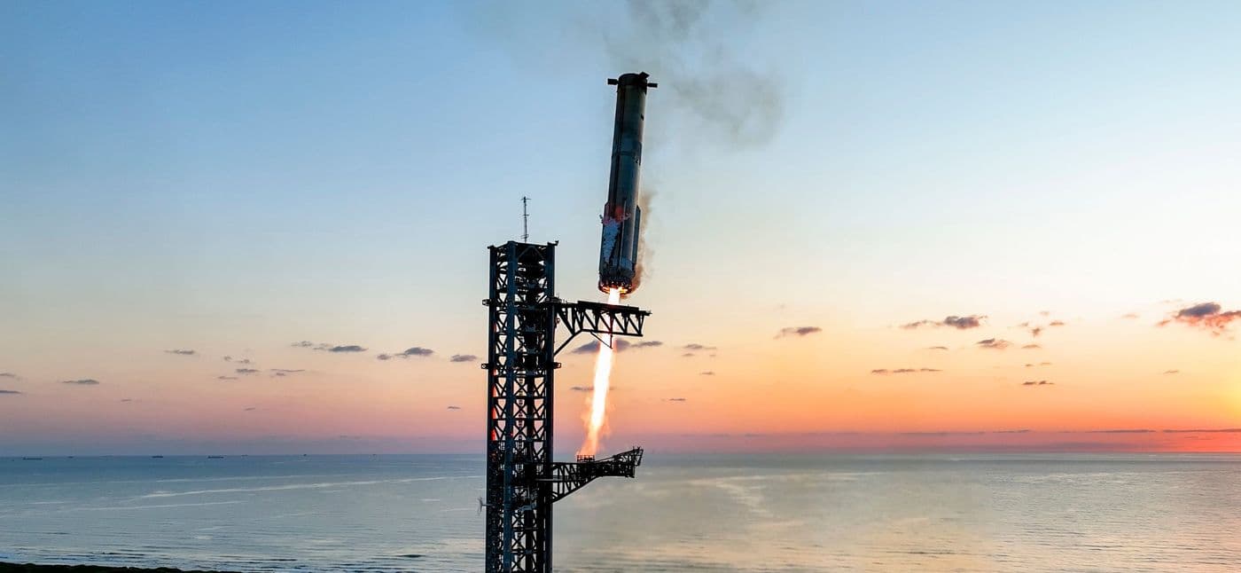 Super Heavy returns to the tower on the fifth flight, 13 October 2024, for the first catch by its arms.
