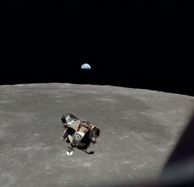 The Eagle ascent stage rises above the Moon with the Earth in the background (NASA AS11-44-6642).