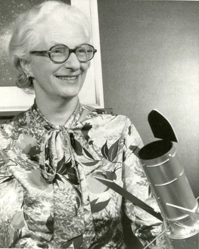Astronomer Nancy Grace Roman poses in 1966 with a model of what later became the Hubble Space Telescope.